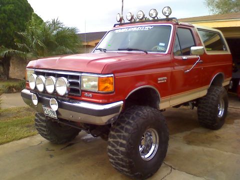 1990 Ford Bronco - This lifted 1990 Ford Bronco features oversized tires and a custom light bar on the roof.