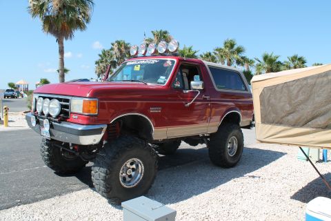 1990 Ford Bronco - This lifted 1990 Ford Bronco is equipped with multiple off-road lights and appears ready for an adventure.