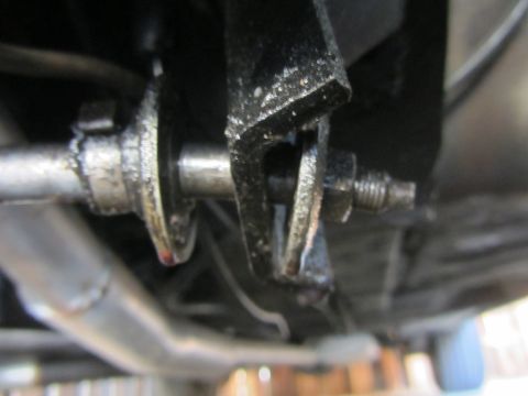 1964 Ford Ranchero - This is a close-up view of a vehicle's steering linkage mechanism, showing a rod and connecting hardware.
