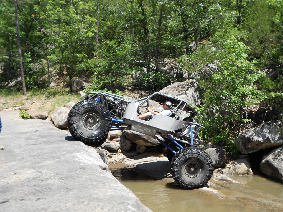 Custom buggy with large tires on rocks