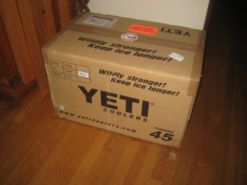1996 Ford Bronco - A Yeti cooler box is shown on a wooden floor.