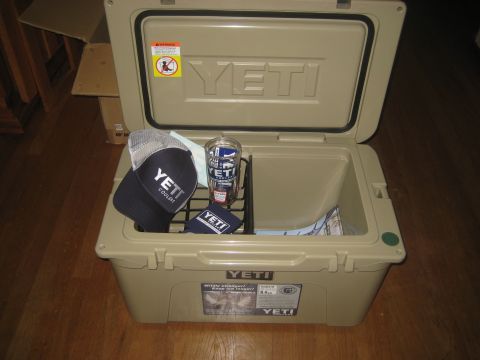 1996 Ford Bronco - An open Yeti cooler contains a hat, cup, and bag, with a box in the background.