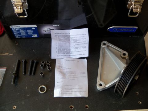 1995 Ford Bronco - AC removal parts kit laid out on a surface with instructions.