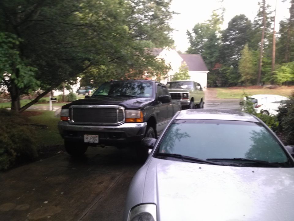 Green 1979 Ford Bronco parked in driveway