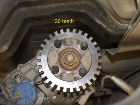 1997 Ford Ranger - A toothed wheel, labeled '30 teeth', is attached to a vehicle's drivetrain.