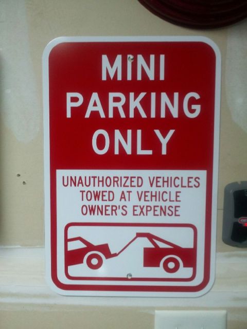 2010 MINI Cooper - This sign indicates that only MINI vehicles are permitted to park in the designated area.