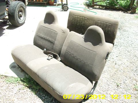 1995 Ford Bronco - Pulling the front seats out are pretty easy. 13mm socket and a breaking bar to get 2 bolts up front and 2 nuts on the rear. Just slide the…