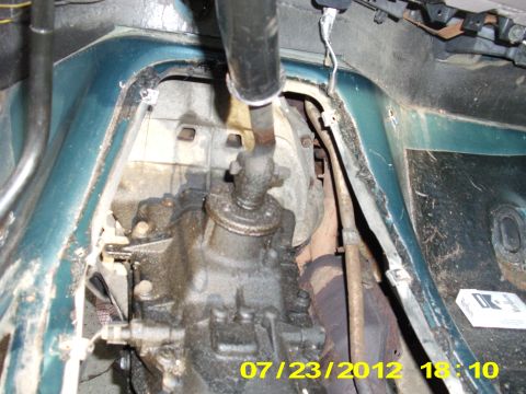 1995 Ford Bronco - Removing the shift is pretty easy, just remove the nut with a 18 mm socket from the right side of the vehicle (Passenger side) and re-tight…