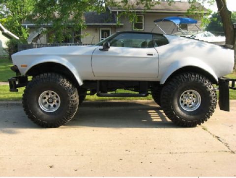 2007 Ford Mustang - This heavily modified classic car sits high on oversized off-road tires.