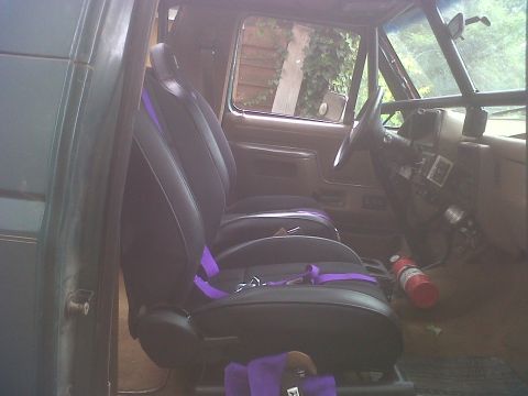 1990 Ford Bronco - Custom interior of a 1990 Ford Bronco racing seats and a roll cage.