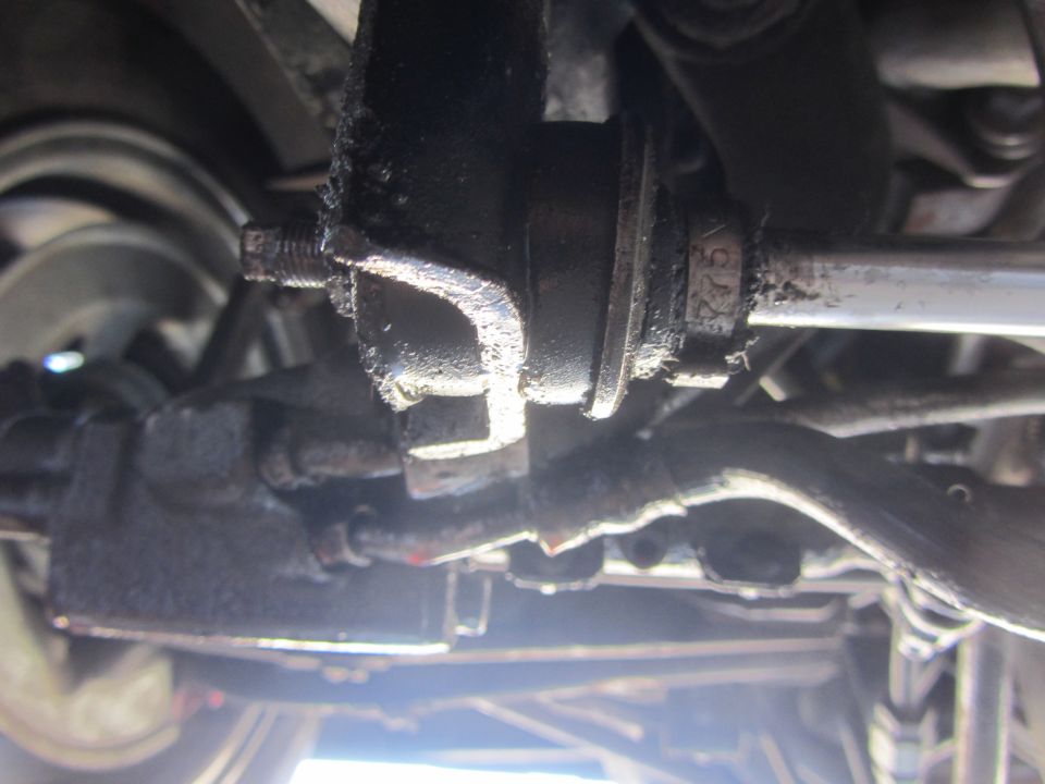 Greasy steering linkage with visible part number 'C222'