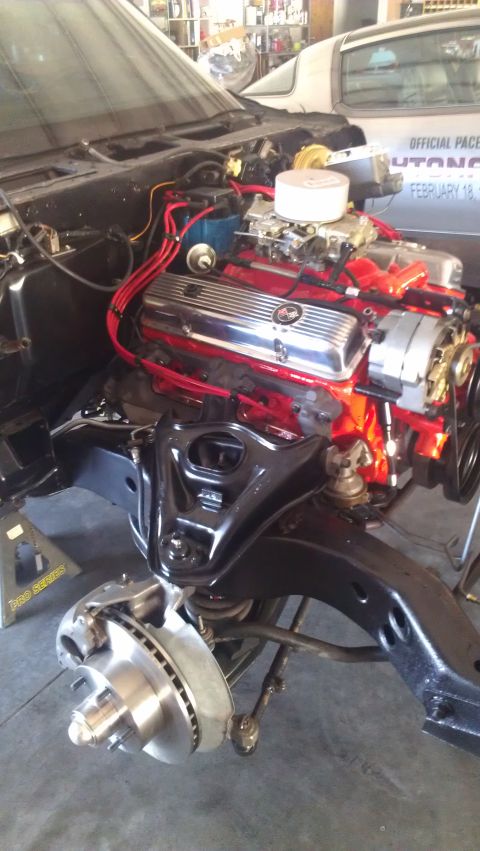 1973 Chevrolet Camaro - Car engine and front suspension components are disassembled and visible.