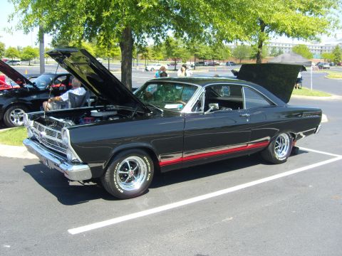 2007 Ford Mustang - This black 1967 Ford Fairlane coupe features a red side stripe and both the hood and trunk are open.