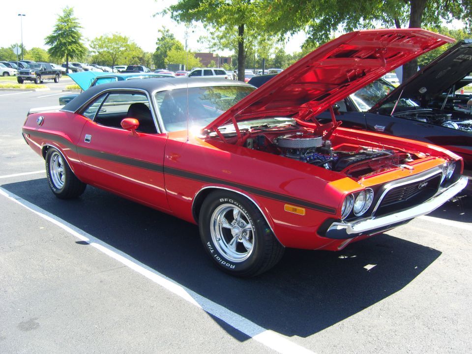 Red Dodge Challenger with hood open, 3q-front view