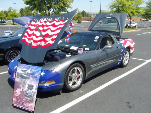 2007 Ford Mustang - A gray Chevrolet Corvette C5 with a patriotic paint scheme is displayed with its hood and trunk open.