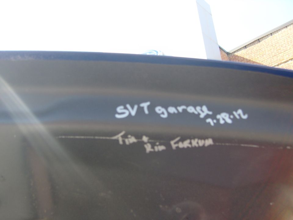Car door with 'SVT garage 7.28.12' and 'Tim & Kim FORKUM' written on it