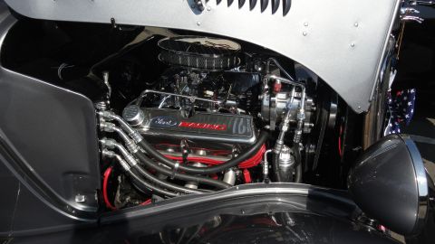 1964 Ford Fairlane - The engine bay of a classic car, a polished Ford Racing V8 engine.