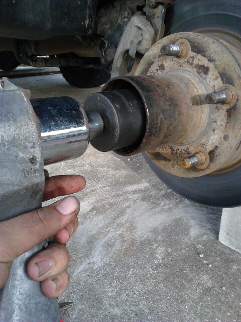 1996 Ford Bronco - Use a 4 prong spindle nut socket to get the first spindle nut off. my threads on my spindle are damaged so i used an impact wrench to zip i…
