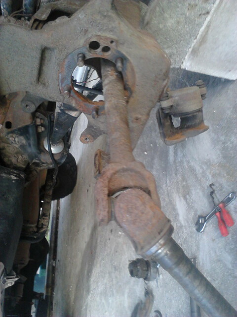 1996 Ford Bronco - Pull the axle shaft out. might have to undo the bands holding the slip yoke boot.