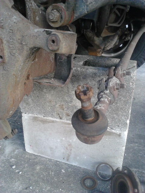 1996 Ford Bronco - Take the Tie Rod End off the knuckle. Best way is take the nut off and put it back on upside down so the nut is flush with the top of the t…
