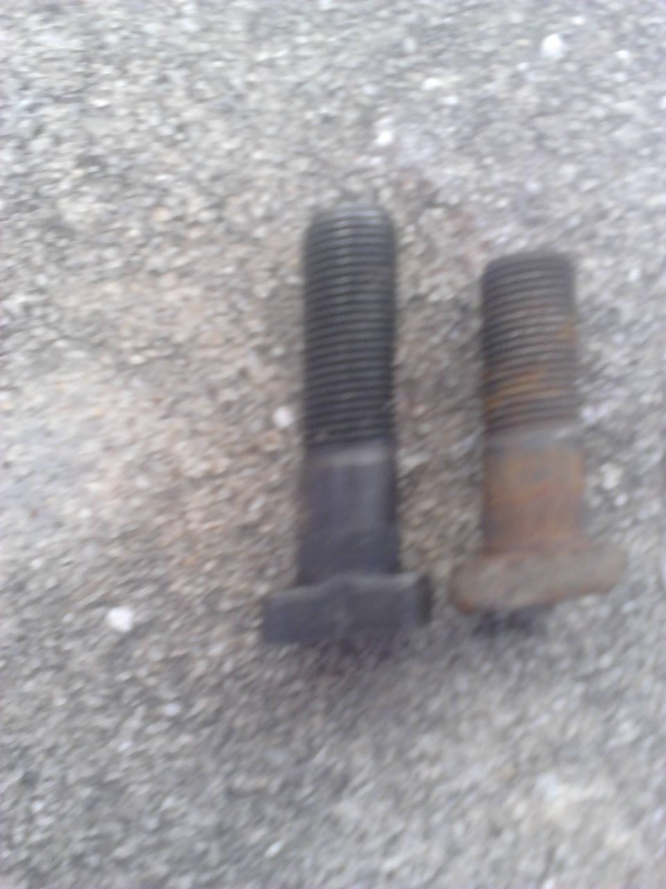 The spindle studs. Right is the old Ford studs. Left is the studs i ordered. I didnt have the actuall Chevy studs to use so i ordered these online. I know the Chevy studs are longer than the Ford studs due to the backing plate but not sure how much. 

I ordered these before on a seperate truck and had to cut them down due to being soo much longer. Figuered that they would work for this project and i was right.

I got these from www.partmike.com and it came with all 12 needed and nuts inclueded.. they are the 3/8" not 7/16" studs.

1-PM63262-12 D44 SPINDLE STUD SET 
http://www.partsmike.com/store/store.php?crn=219&rn=1356&action=show_detail