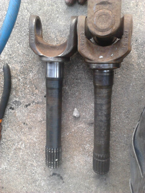 1996 Ford Bronco - Chevy vs Ford outter axle shaft. Right is the Ford outter axleshaft still attached. Left is the Chevy that is going on. Notice the differen…