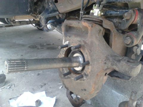 1996 Ford Bronco - Put the axle shaft back in. Put on a new spindle seal. For the passenger side, make sure the shaft goes back into the slipyoke correctly. M…