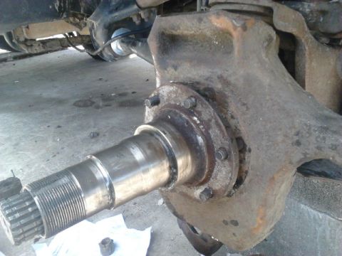 1996 Ford Bronco - Put the spindle on. Shouldnt matter which direction but i like the notch in the threads for the spindle nut to be up. To make sure it would…