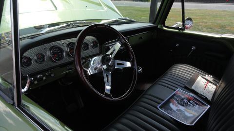 1964 Ford Fairlane - Custom gauges and a wood-rimmed steering wheel are visible inside this vintage truck's interior.