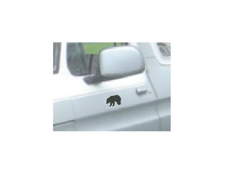 1990 Ford Bronco - A black bear decal is affixed to the side panel of a white vehicle.