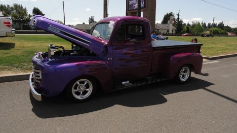 1964 Ford Fairlane - Customized pickup truck with flame paint and open hood displayed outdoors.