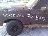 1988 Ford Bronco - A heavily soiled 1988 Ford Bronco displays a message about offroading.