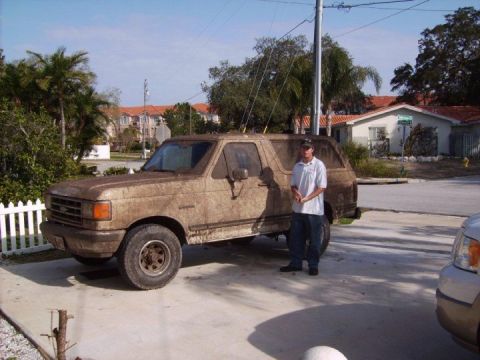 1988 Ford Bronco - This SUV is covered in mud, suggesting recent off-road use.