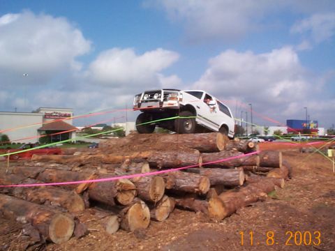 1992 Ford Bronco - Climbing to the top of the log pile.