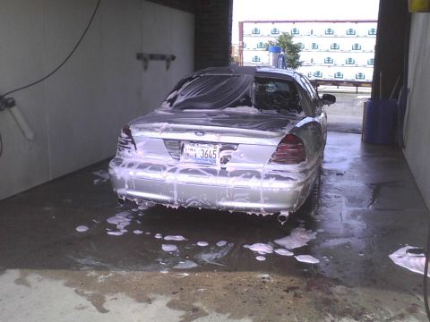 2003 Ford Crown Victoria - A 2003 Ford Crown Victoria gets a thorough washing at a self-service car wash.