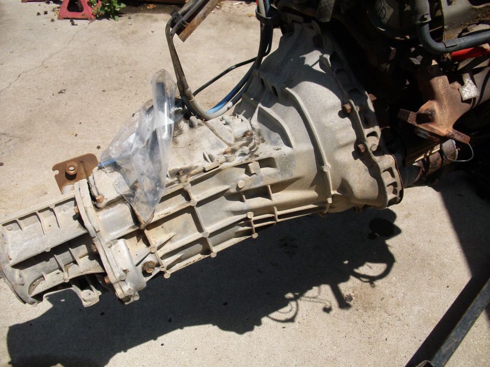 Transmission assembly with protective plastic covering