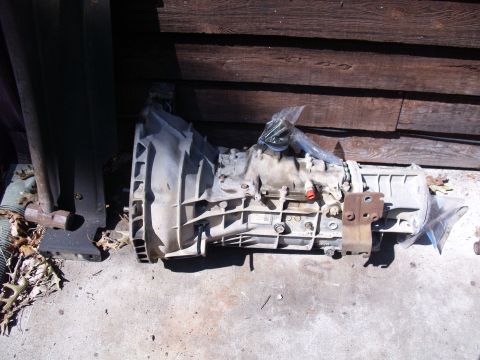 1995 Ford Bronco - Transmission assembly shown outside, possibly for sale or repair.