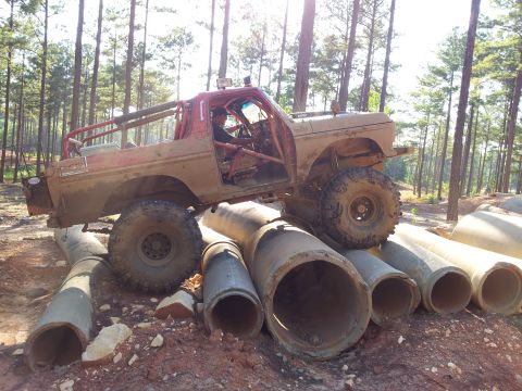 Ford Bronco - Modified 1978 Ford Bronco navigating an obstacle course made of concrete pipes.