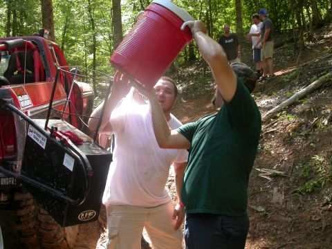 1990 Ford Bronco - People are taking a break from off-roading to get some water.