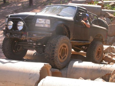 1990 Ford Bronco - This 1990 Ford Bronco is tackling a challenging off-road obstacle course.