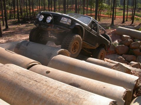 1990 Ford Bronco - This modified SUV navigates a challenging obstacle course made of large concrete pipes.