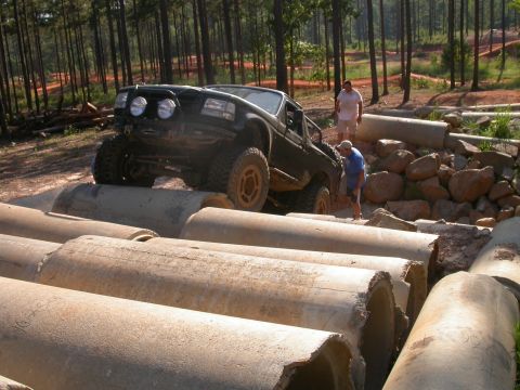 1990 Ford Bronco - Ford Bronco tackles a challenging obstacle course made of concrete pipes.