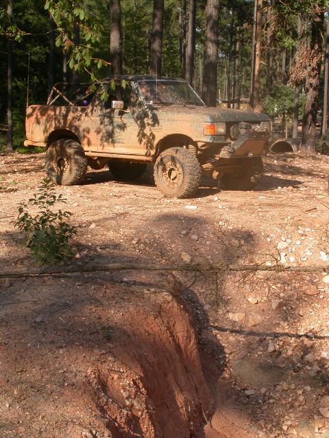 1990 Ford Bronco - This modified Toyota pickup is covered in mud after an off-road excursion.