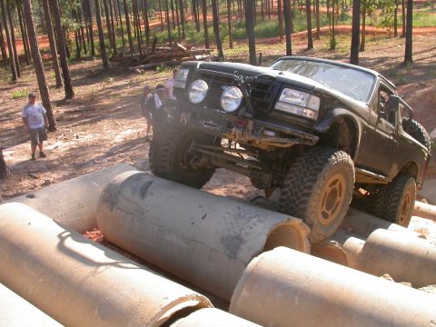 1990 Ford Bronco - This 1990 Ford Bronco navigates a challenging off-road obstacle course large concrete pipes.