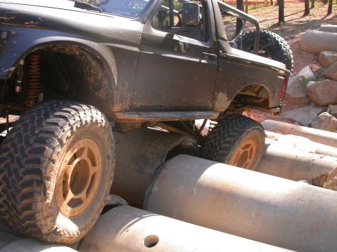 1990 Ford Bronco - Modified 1990 Ford Bronco tackling an off-road obstacle course.