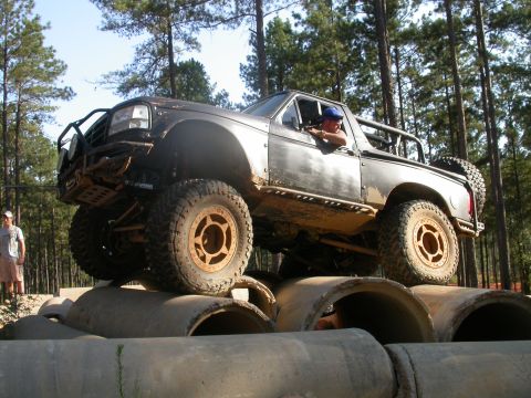 1990 Ford Bronco - This lifted 1990 Ford Bronco navigates an obstacle course of large concrete pipes.