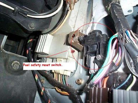 1992 Ford Bronco - Close-up of the fuel safety reset switch and associated wiring.