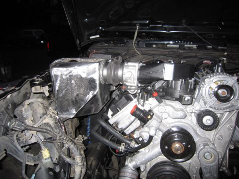 2008 Jeep Wrangler - Custom intake system installed in an engine bay, focus on the intake box and engine components.