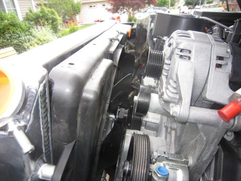2008 Jeep Wrangler - Close-up view of engine components including the radiator, fan, and alternator.