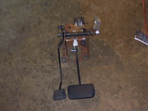 1991 Ford LTD Crown Victoria - Assembly of brake and accelerator pedals mounted on a bracket, likely for a vehicle.